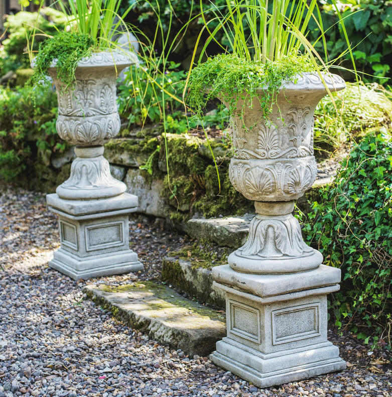 Pair of Large Victorian Stone Cast Urns with Plinths