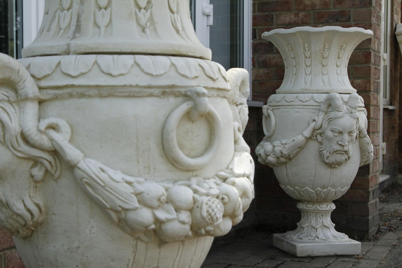 Pair of Urns With Mythical Horned Man Design