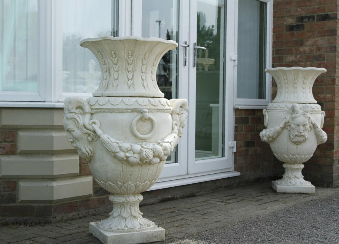 Pair of Urns With Mythical Horned Man Design