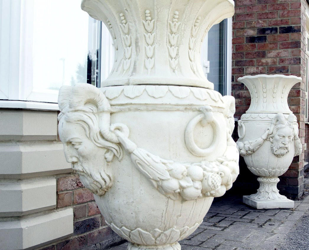 Pair of Urns With Mythical Horned Man Design