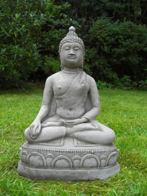 Small Meditating Buddha statue on plinth