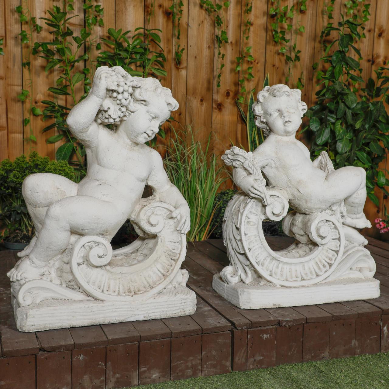 Very Large Pair of Cherub Statues with Fancy Columns