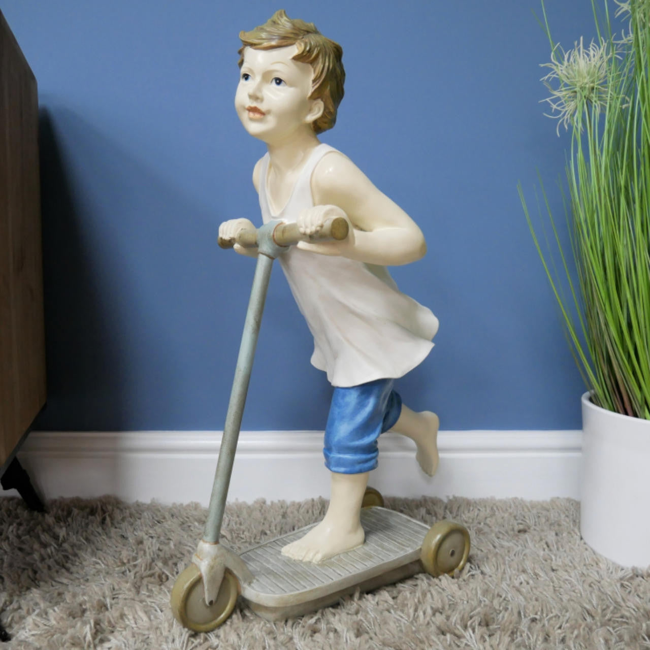 Boy on Scooter garden and home ornament