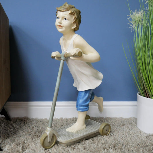 Boy on Scooter garden and home ornament