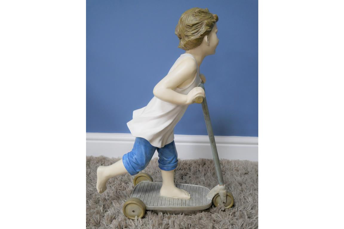 Boy on Scooter garden and home ornament