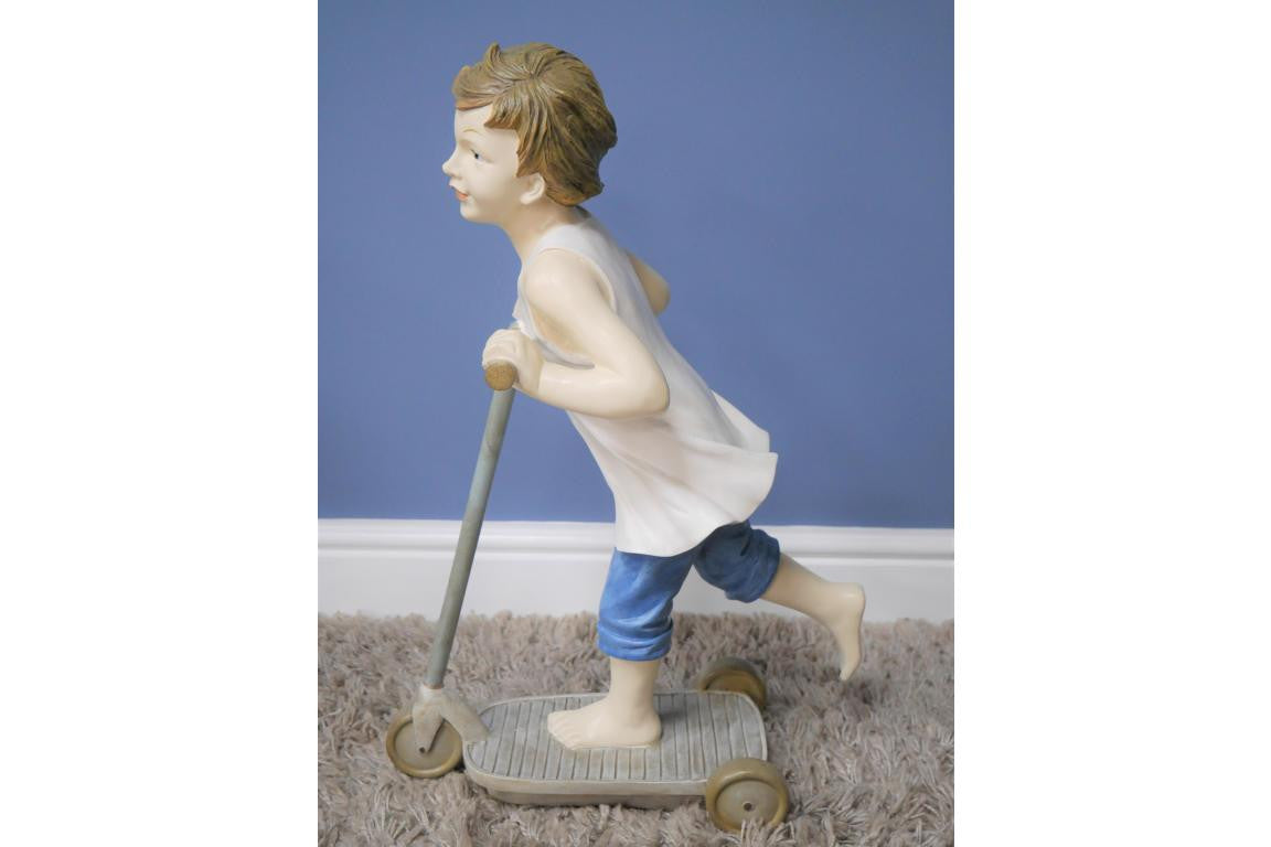 Boy on Scooter garden and home ornament