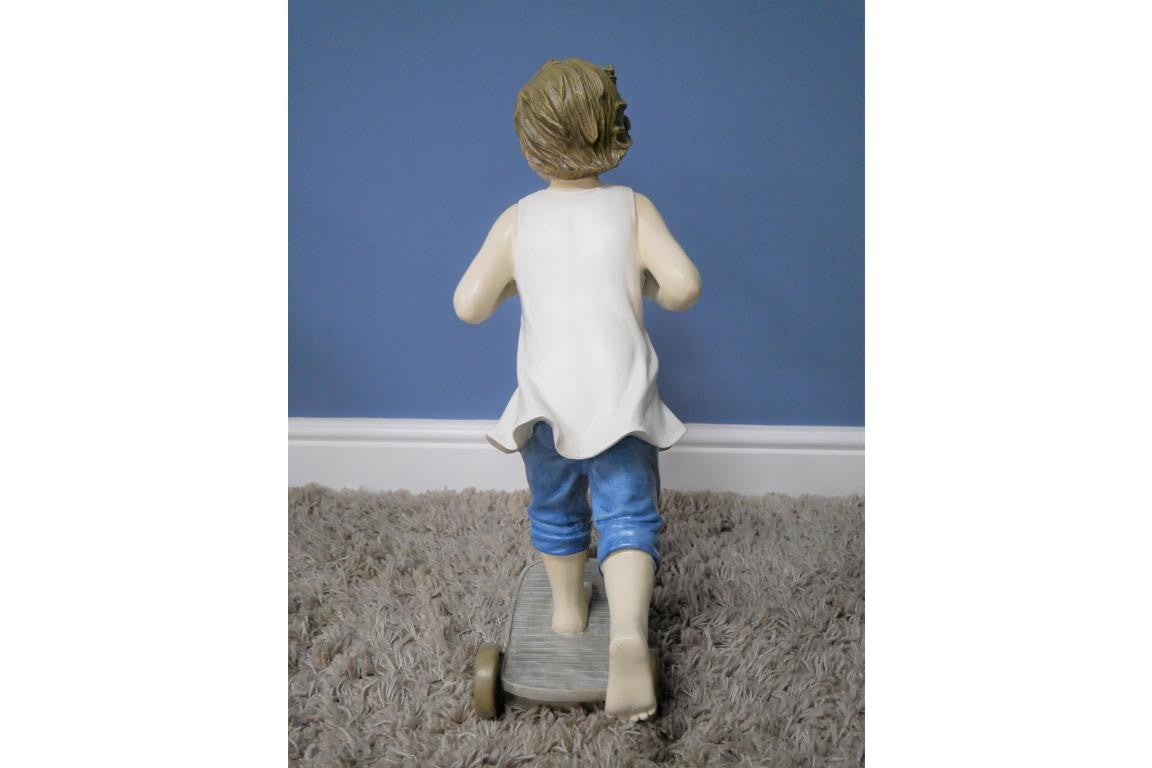 Boy on Scooter garden and home ornament