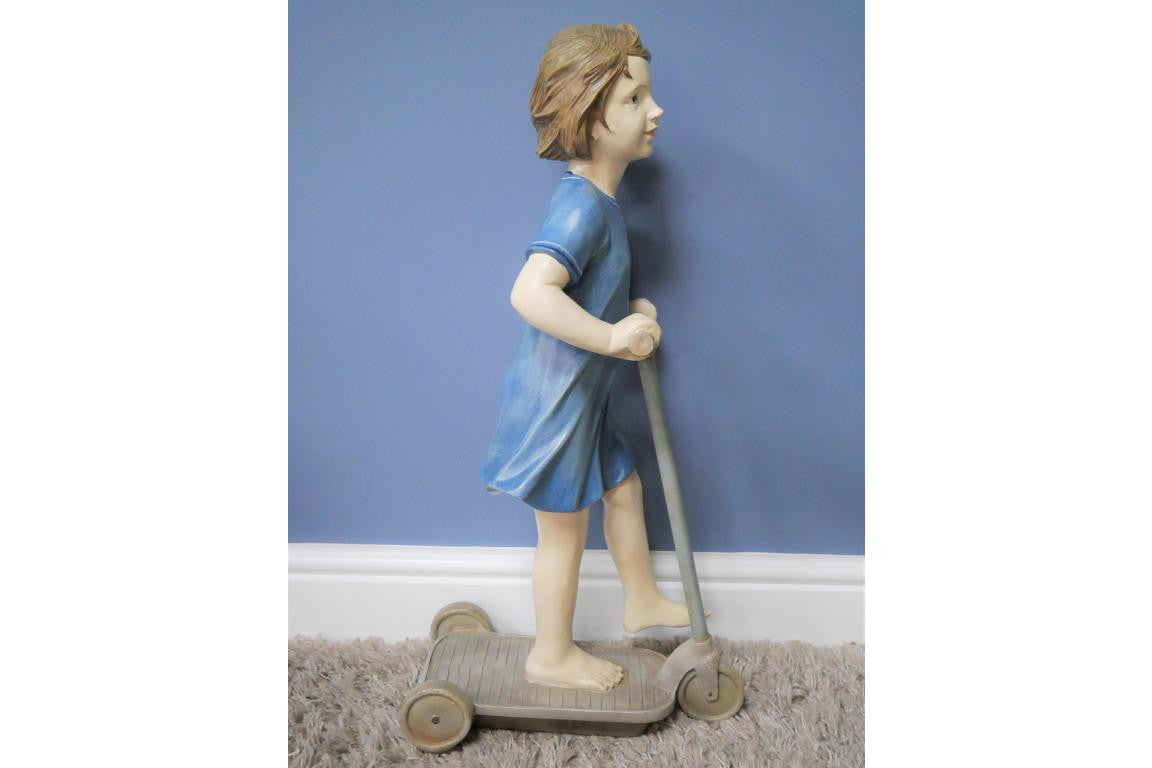 Girl on Scooter Garden and home ornament