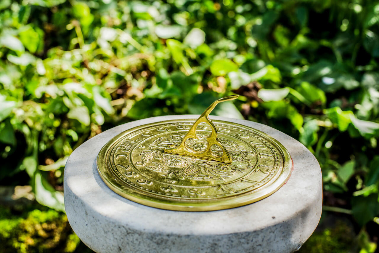 Large Sundial On Classic Stone Column