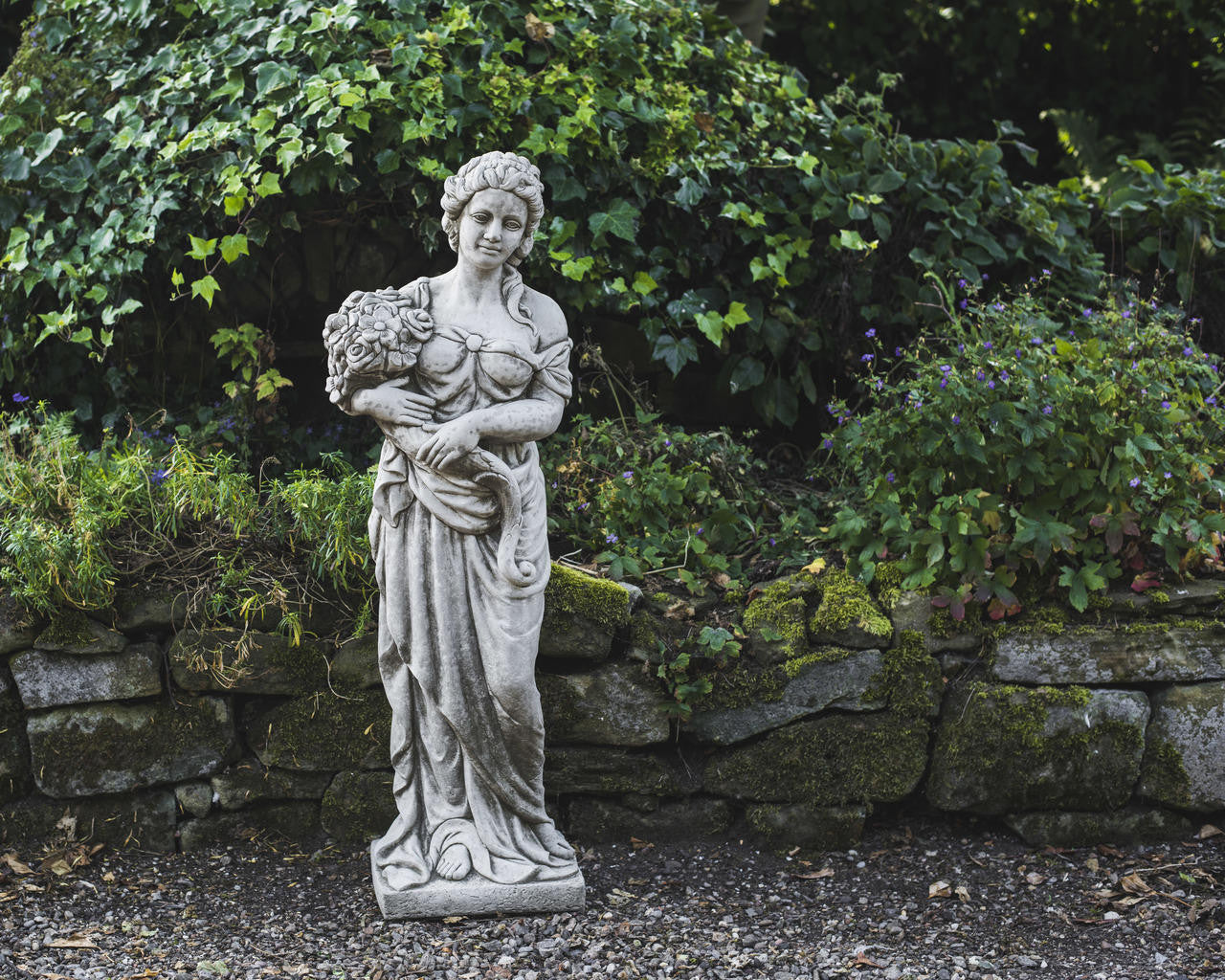 Tall Stone Cast Lady with Flowers