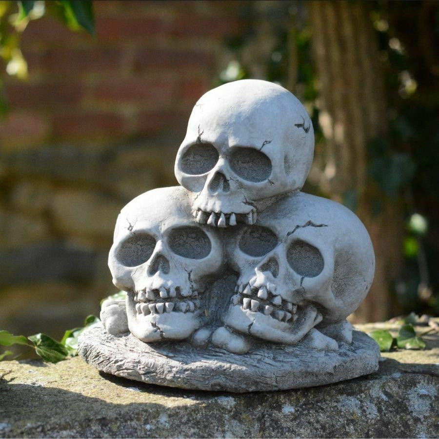 Three Skull Stone cast Garden Ornament